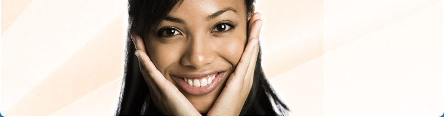 smiling teen with hands on face